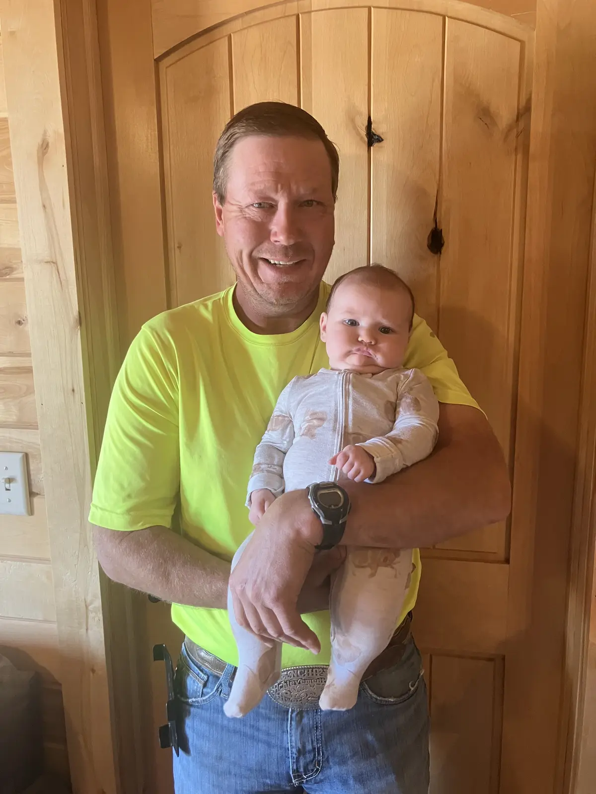 Jon Dorau holding his granddaughter