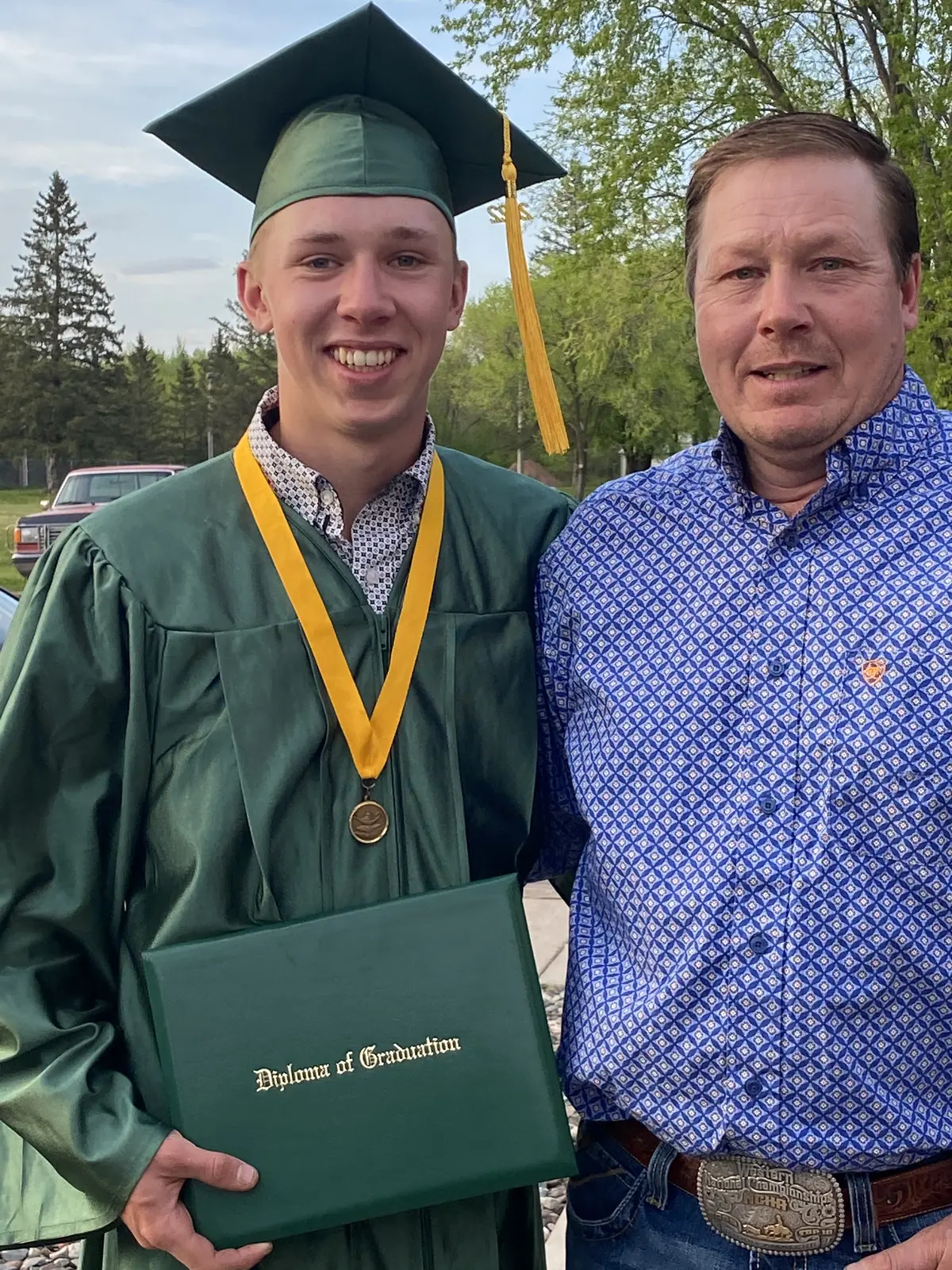 Jon Dorau celebrating a graduation with his son