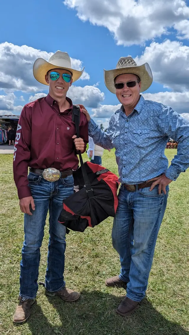 Jon Dorau with his son at a Pine County rodeo